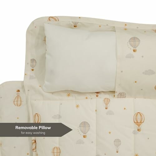 Baby bedding set with hot air balloon pattern and removable pillow.