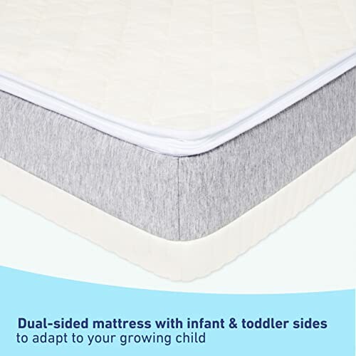 Dual-sided mattress for infants and toddlers with gray and white design.